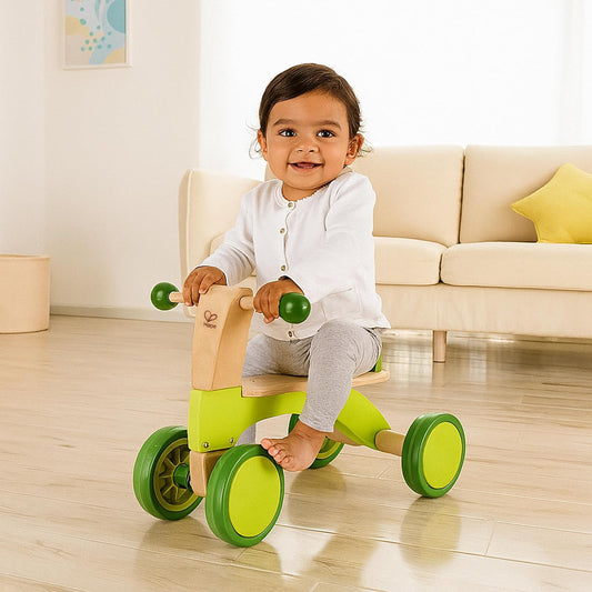 Hape Scoot Around Ride On Wood Bike | Award Winning Four Wheeled Wooden Push Balance Bike Toy for Toddlers with Rubberized Wheels, Bright Green
