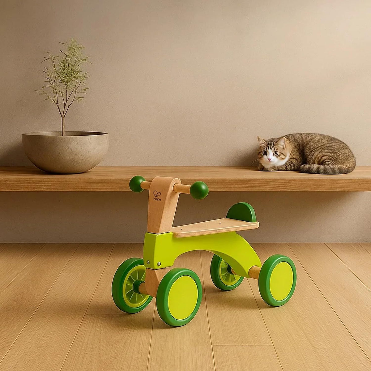 Hape Scoot Around Ride On Wood Bike | Award Winning Four Wheeled Wooden Push Balance Bike Toy for Toddlers with Rubberized Wheels, Bright Green